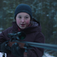 Bella Ramsey as Ellie holds a sniper rifle in a moment from HBO's The Last of Us.